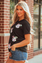 Load image into Gallery viewer, Black Shimmering Sequin Bow Ball Patterned Game Day Casual Tee