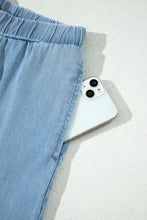 Load image into Gallery viewer, Dusk Blue Ruffled Hem Wide Leg Chambray Pants