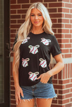 Load image into Gallery viewer, Black Shimmering Sequin Bow Ball Patterned Game Day Casual Tee